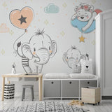 Baby room elephant wallpaper displayed in a cozy reading nook with rocking chair and soft lighting