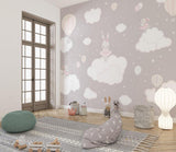 Hot air balloon nursery wallpaper bringing whimsy to a reading nook with rocking chair
