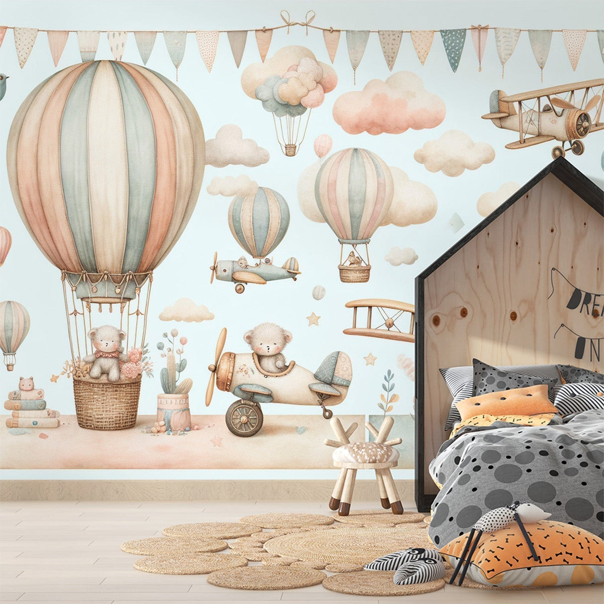 Hot air balloon nursery wallpaper creating a cozy atmosphere in a soft-lit baby room with white furniture