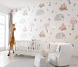 Pink flamingo and elephant nursery wallpaper in a modern white nursery with natural wood furniture