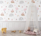Safari nursery wallpaper creating a cozy reading nook with pink and grey accents
