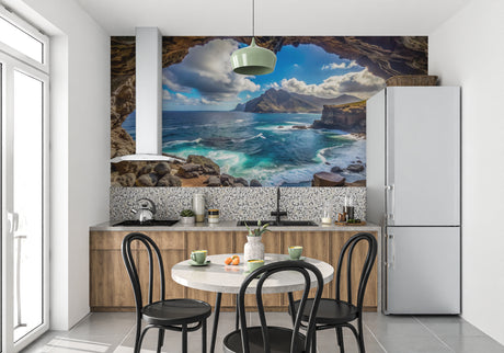Ocean cave wallpaper creating depth in modern living room with white furniture and natural light