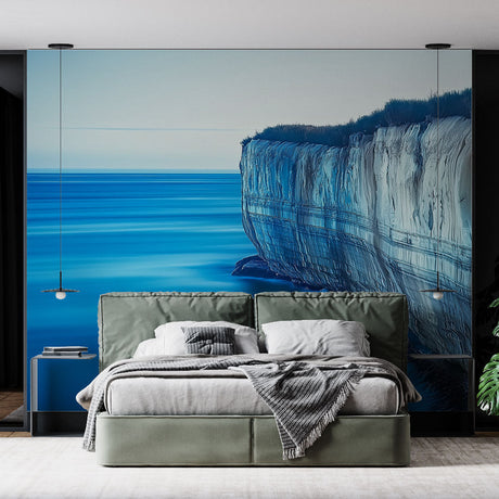 Ocean cliff wallpaper creating depth in a modern living room with natural light highlighting the coastal landscape