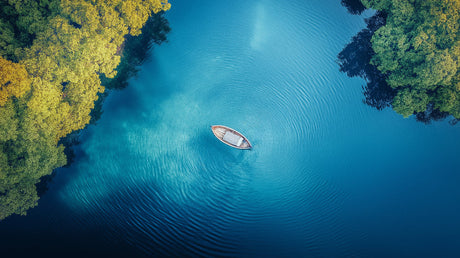 Ocean view wallpaper design file showing crystal clear turquoise waters and wooden boat from above