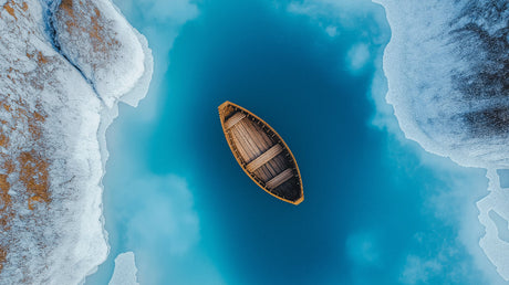 Ocean view wallpaper design file showing aerial perspective of wooden boat on turquoise waters