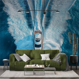 Luxury yacht wake wallpaper creating drama in modern living room with white furniture and ocean views