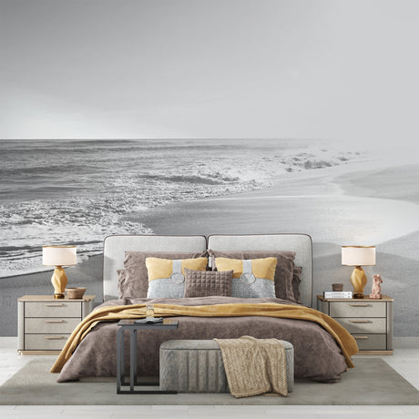 Black and white beach waves mural wallpaper in modern minimalist living room setting