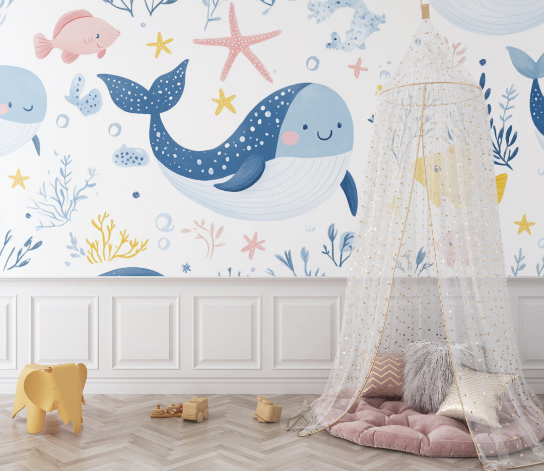 Kids bedroom transformed with marine life wallpaper featuring friendly whales and colorful fish