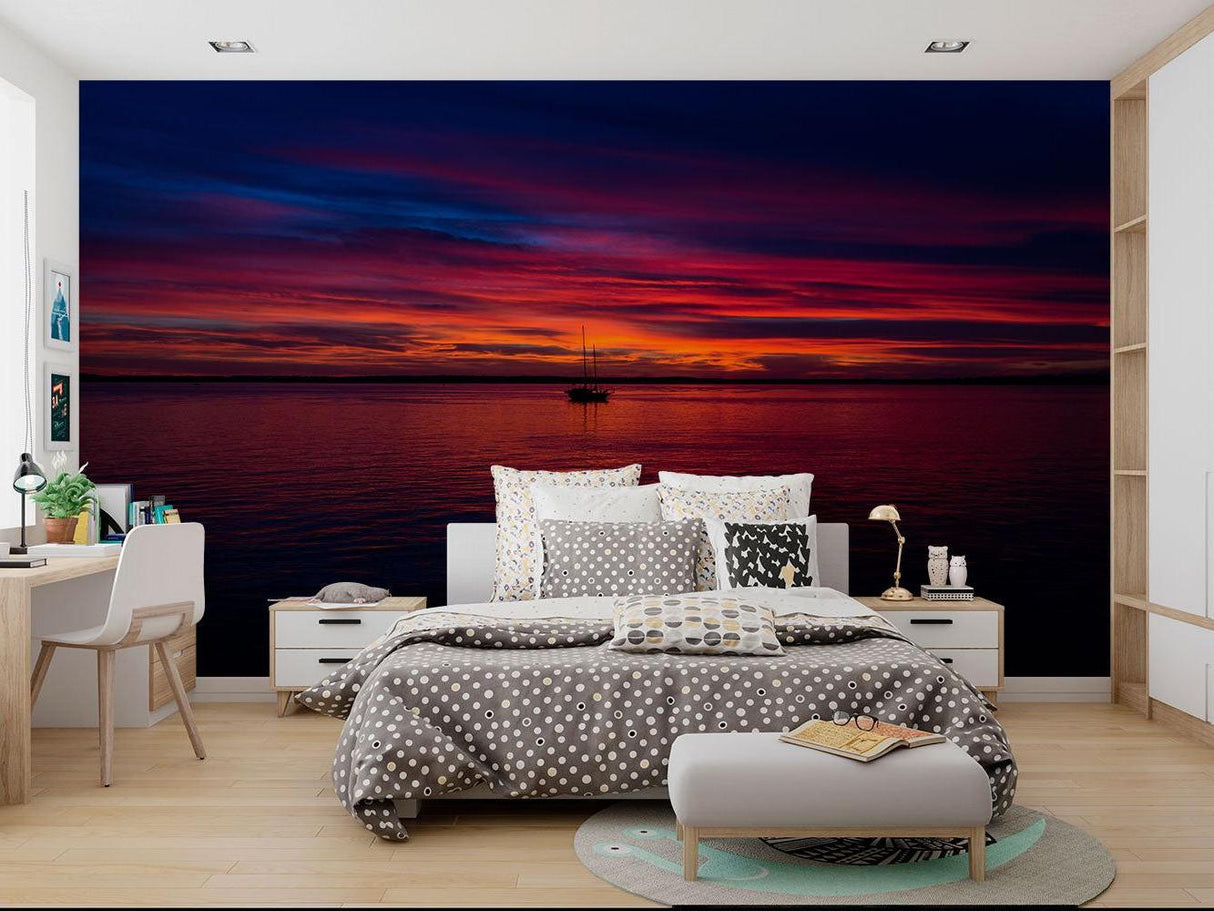 Seascape sunset mural adding depth to a minimalist dining room space