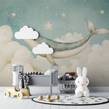 Ocean themed wallpaper transforming a kids bedroom with floating whale and golden stars