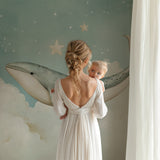 Whale and stars mural creating a calming atmosphere in a baby's room