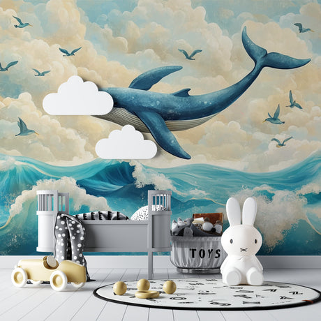 Ocean whale wallpaper mural styled in a bright modern nursery with white furniture