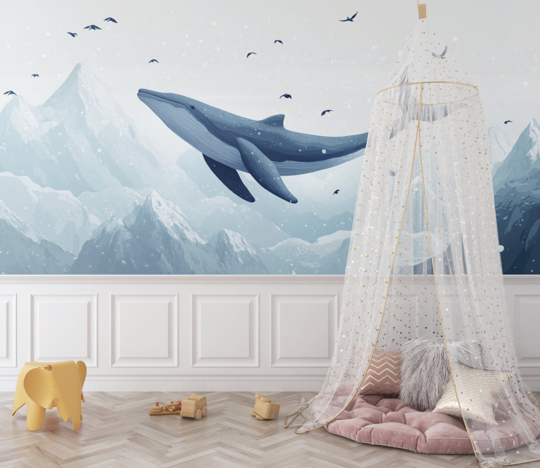 Ocean themed wall mural transforming a playroom with dreamy whale design