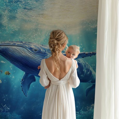 Ocean Mural Wallpaper featuring blue whale in nursery room, creating peaceful underwater atmosphere