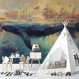 Whale and castle wall mural transforming a nursery with soft, dreamy colors