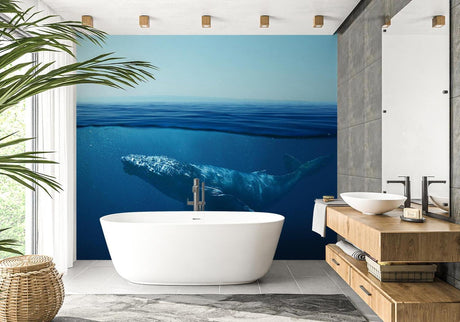Blue Whale underwater wallpaper mural displayed in a modern minimalist bedroom, creating a peaceful ocean atmosphere