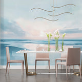 Ocean mural wallpaper creating a serene atmosphere in a modern living room with coastal decor