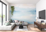 Ocean wall mural adding depth to a dining room with gentle watercolor waves