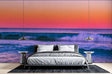 Ocean wave wallpaper creating a serene atmosphere in modern living room with sunset colors