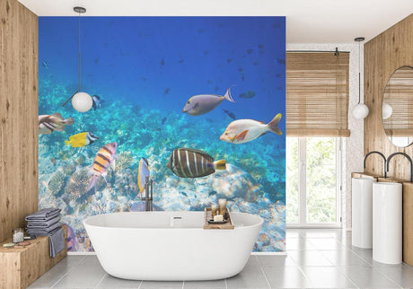 Ocean mural wallpaper with tropical fish and coral reef transforms this modern bathroom into an underwater paradise