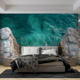 Ocean mural wallpaper creating a stunning focal point in a modern living room with white furniture