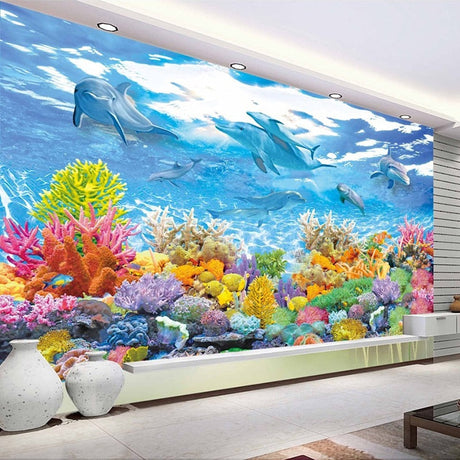 Ocean mural wallpaper bringing underwater magic to a modern living room with coral reef and dolphins