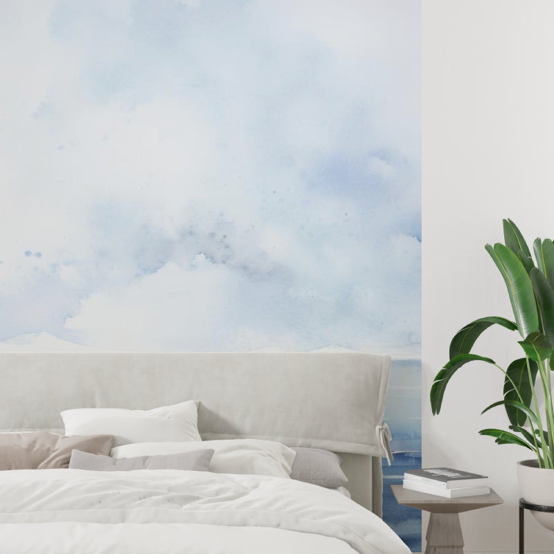 Ocean landscape wallpaper creating a serene atmosphere in a modern living room with natural light