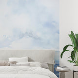 Ocean landscape wallpaper creating a serene atmosphere in a modern living room with natural light