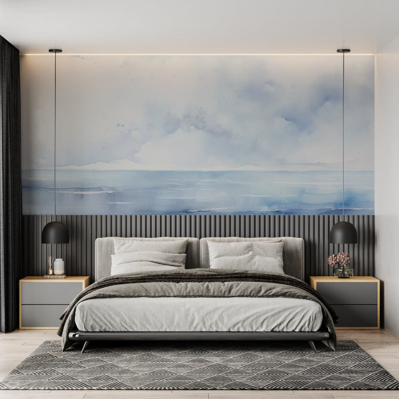 Watercolor sea mural adding depth to a minimalist bedroom setting