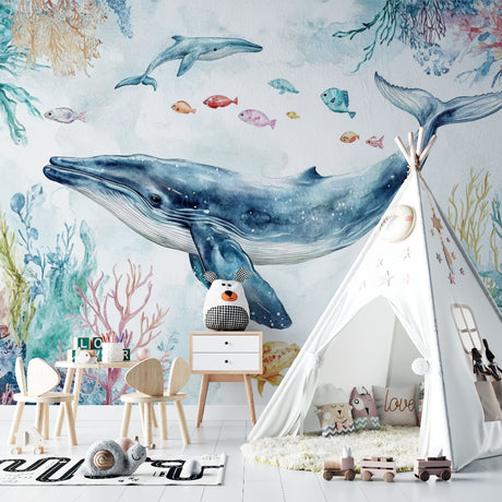 Ocean whale wallpaper mural in cozy nursery with soft lighting and wooden furniture