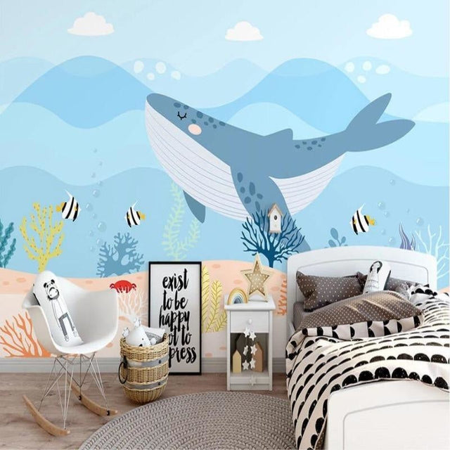 Ocean Whale Wallpaper in cozy nursery with white furniture showing scale and soft blue tones