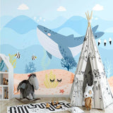 Underwater whale mural in modern playroom showing full wall application