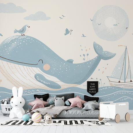 Ocean theme wallpaper bringing life to a modern nursery with gentle whale and sailboat design