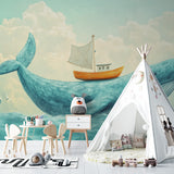 Whale wall mural creating a magical atmosphere in a kids playroom with reading nook