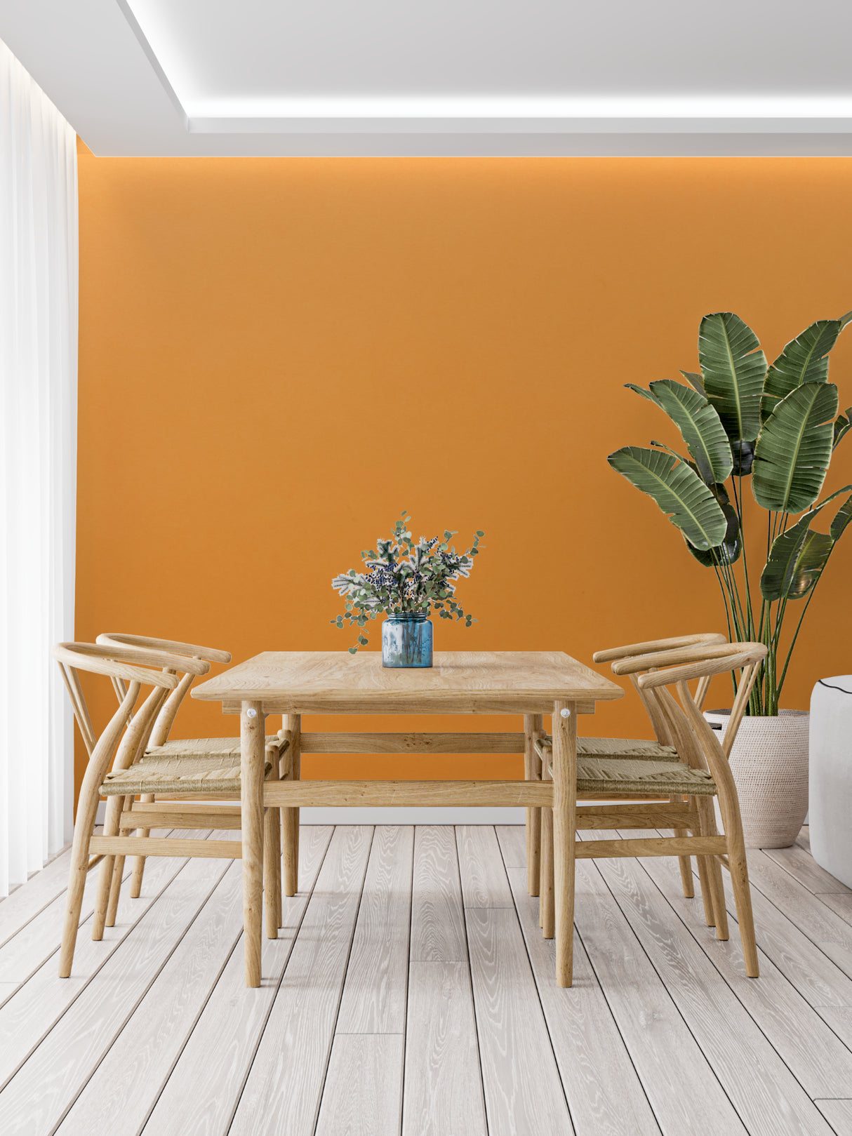 Orange wall mural in modern living room creating warm, inviting atmosphere with minimal furniture