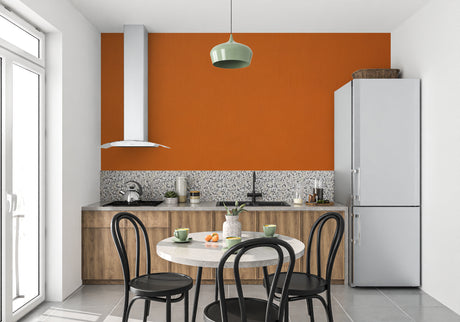 Orange wall mural in modern living room showing warm, inviting atmosphere with minimalist furniture