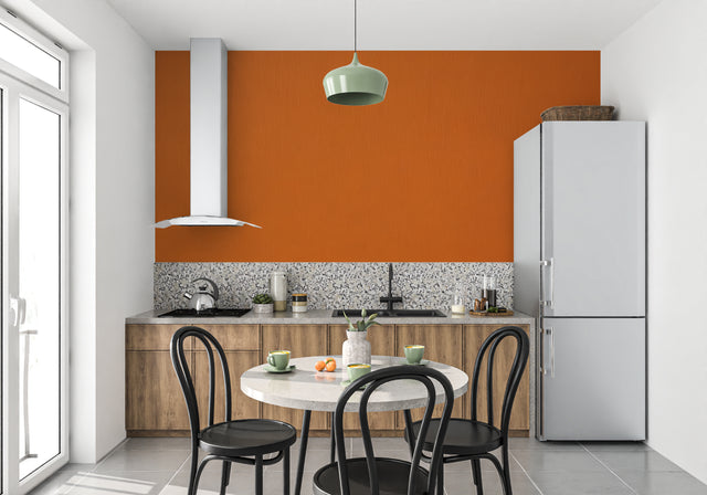Orange wall mural in modern living room showing warm, inviting atmosphere with minimalist furniture