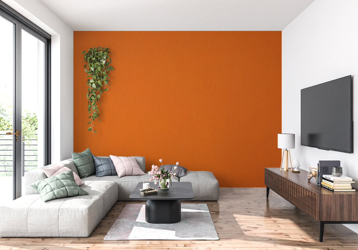 Orange wallpaper installation in hallway showing texture detail