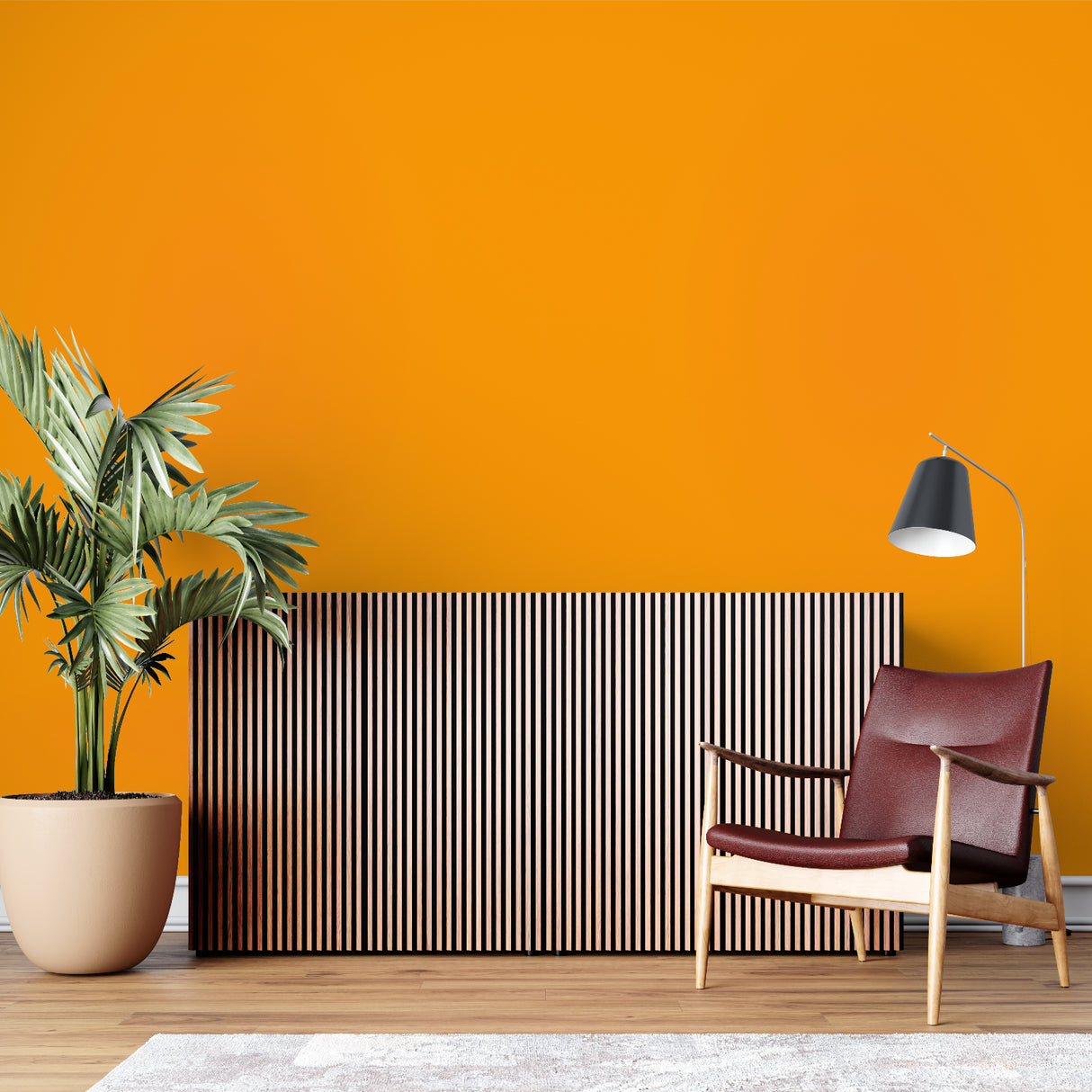 Orange wall mural in a creative workspace showing its versatility with white furniture