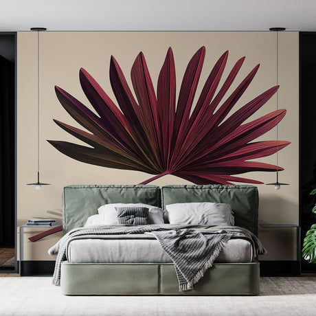 Burgundy palm leaf wallpaper creating a stunning focal point in a modern living room with gray sofa and natural light