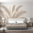 Palm leaf wallpaper mural creating a calm atmosphere in a bright modern living room with beige sofa and natural decor