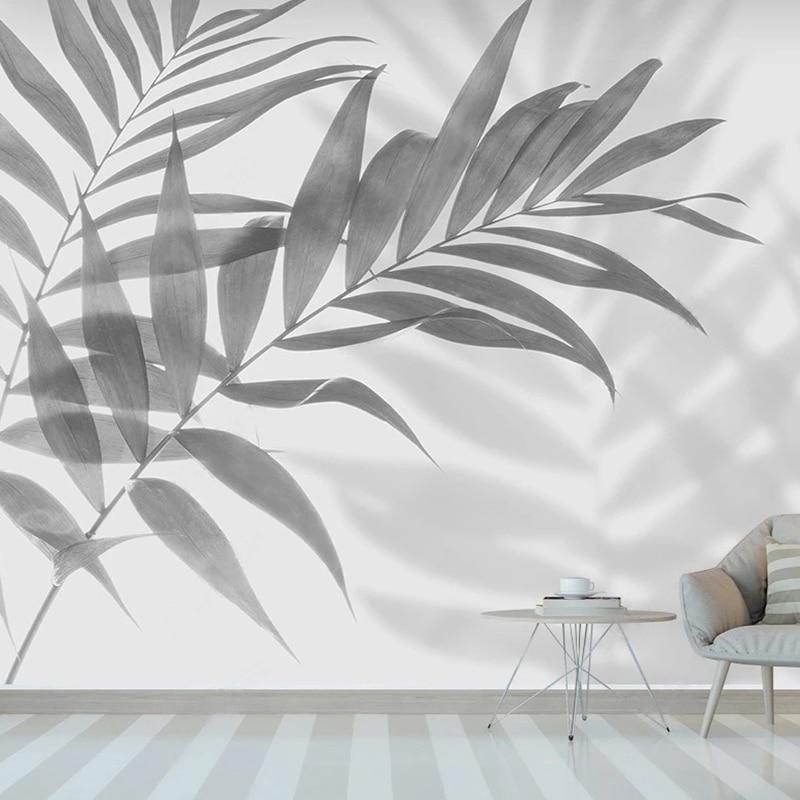 Monochrome palm leaf wallpaper bringing natural elegance to a modern dining room