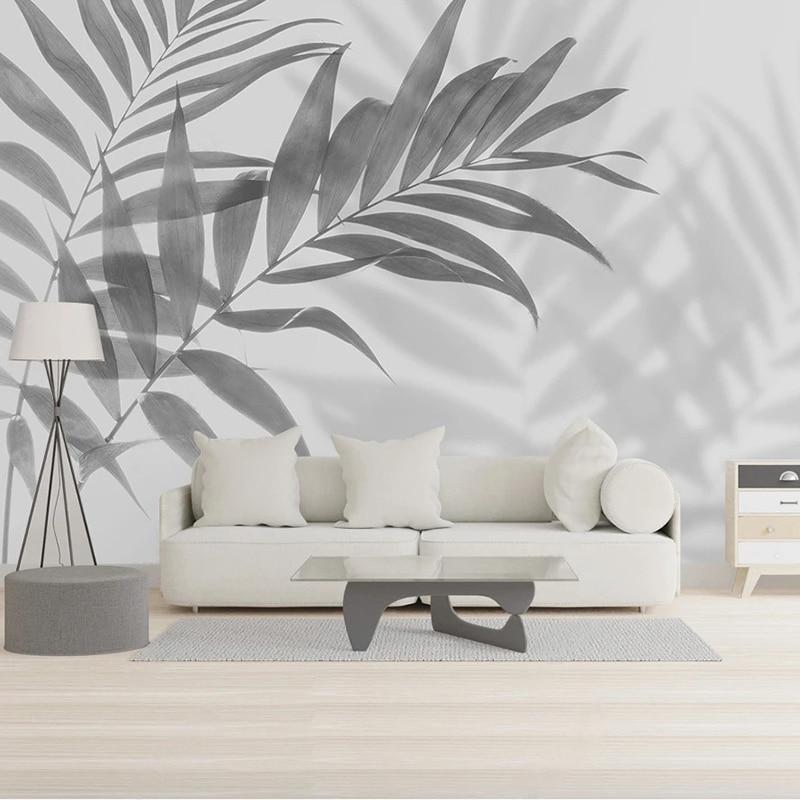Black and white palm leaf mural creating a striking office accent wall