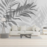 Black and white palm leaf mural creating a striking office accent wall