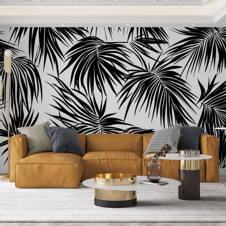 Modern black and white palm leaves wallpaper creating dramatic contrast in a minimalist living room setting