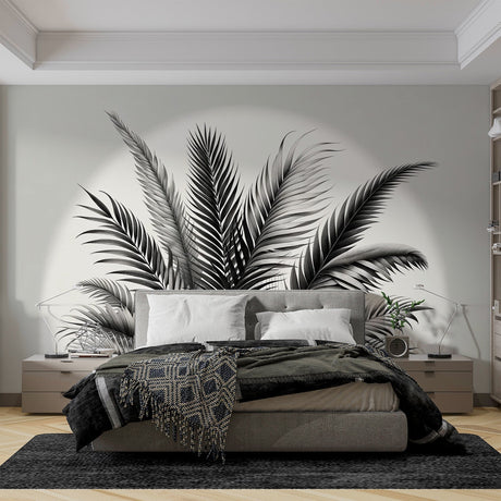 Black and white palm leaf wallpaper creating dramatic contrast in a modern living room with minimalist furniture
