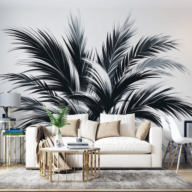 Black and white palm wallpaper creating dramatic impact in modern living room with minimal furniture