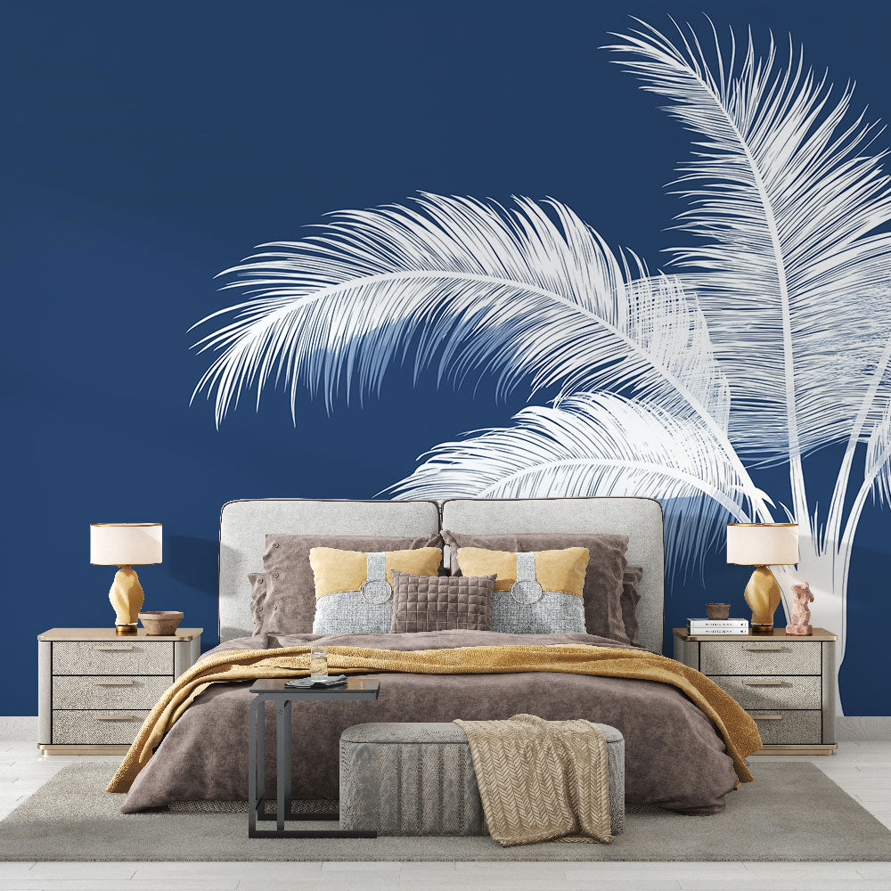 Navy blue Palm Tree Wallpaper creating a coastal vibe in modern living room with white sofa and natural light