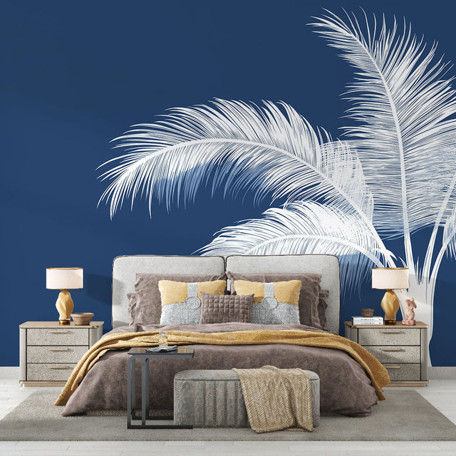 Navy blue Palm Tree Wallpaper creating a coastal vibe in modern living room with white sofa and natural light