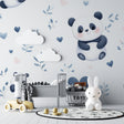 Panda nursery wallpaper in a cozy baby room with soft lighting and matching decor